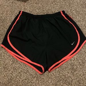 Black Nike running shorts with pink highlights